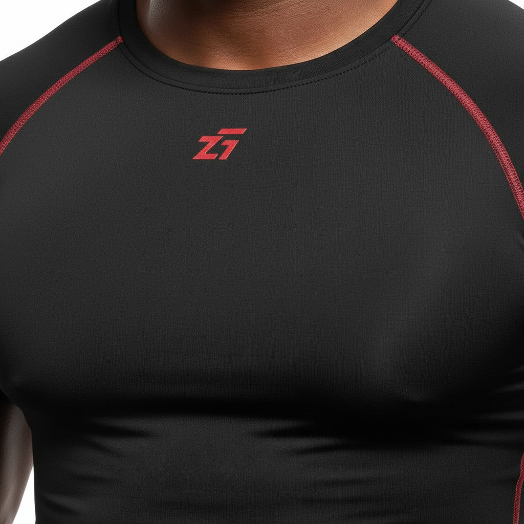 Zigueii Agborlor compression t-shirt in black with red contrast stitching and logo detail on the chest.